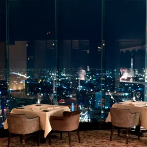 Mezzaluna Two Michelin starred fine dining with a cityscape backdrop